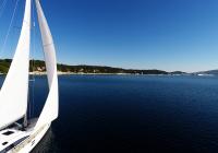 sailing yacht sails to sea bay blue sky sailing yacht